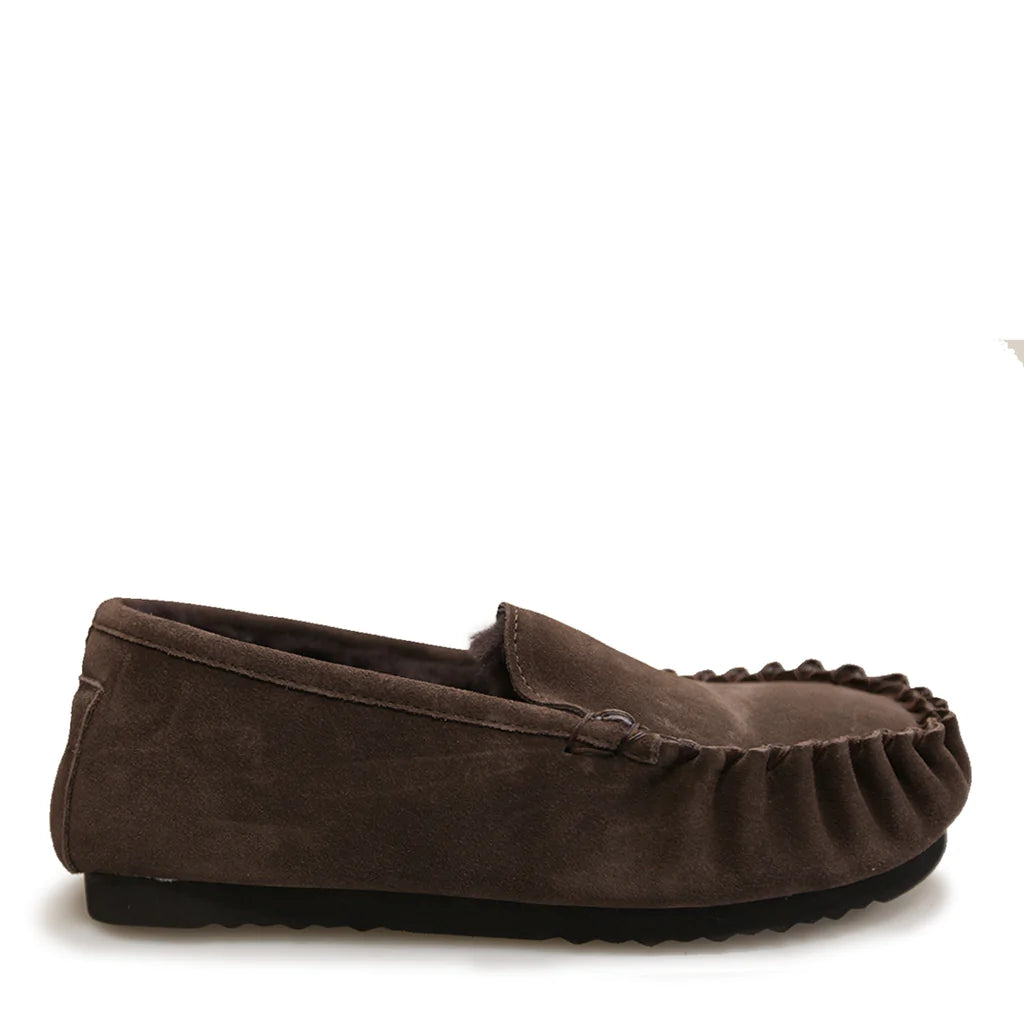 A brown men's moccasin with a suede upper and a sheepskin insole.