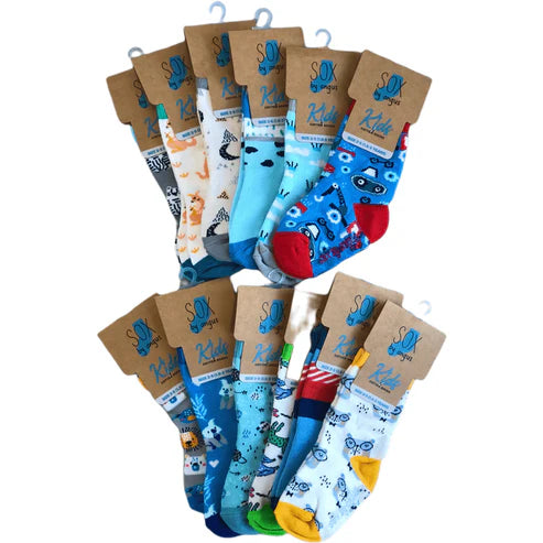Colorful children's socks with various patterns on cardboard packaging.