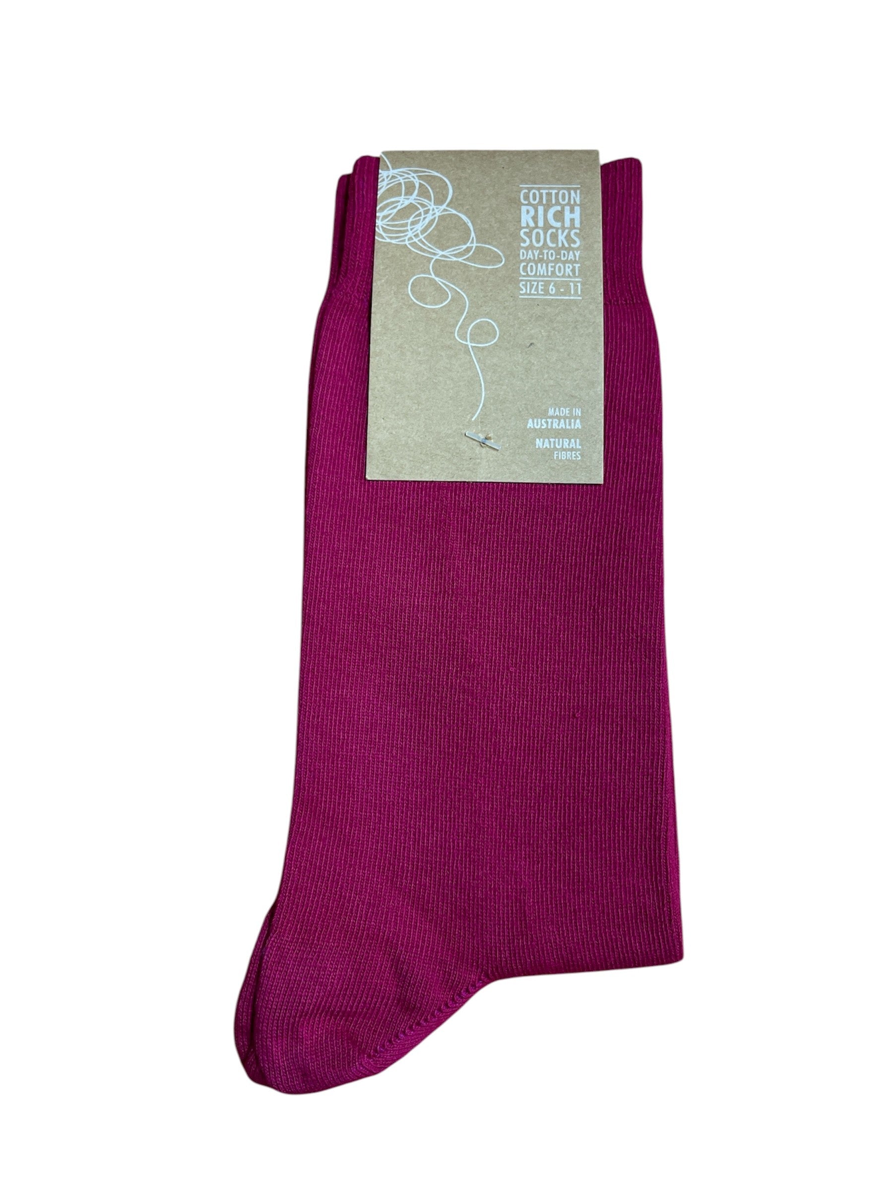 Fushia sock with a label on a white background