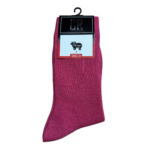 Hot pink sock on a white background with a brand label.