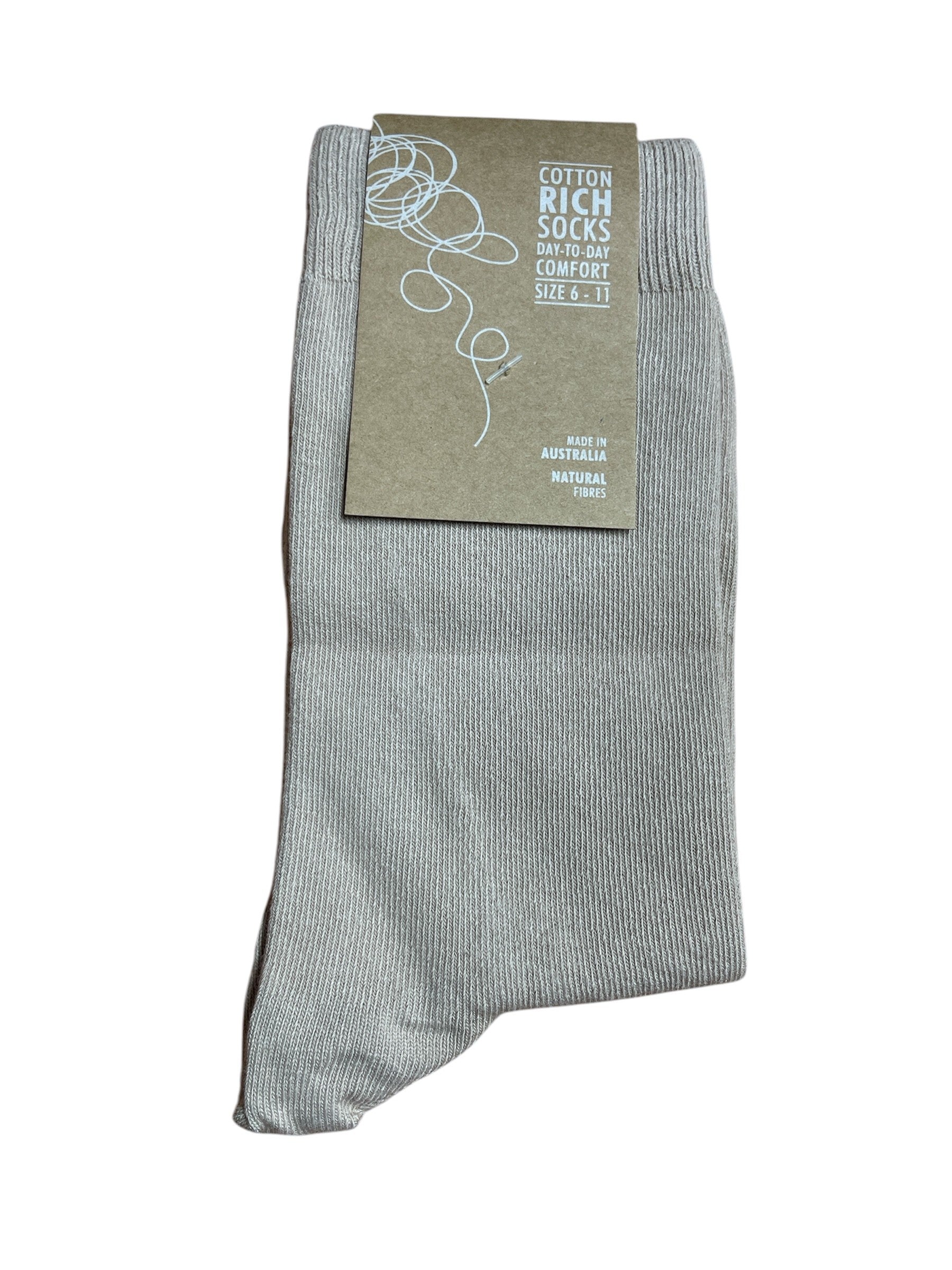 Beige sock with a label on a white background