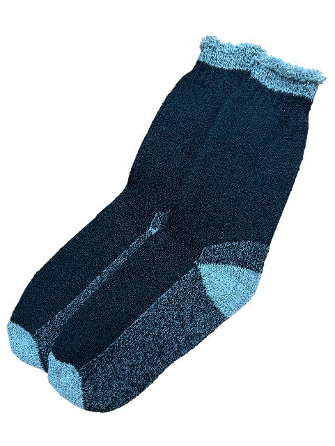 Pair of black socks with textured pattern on a white background