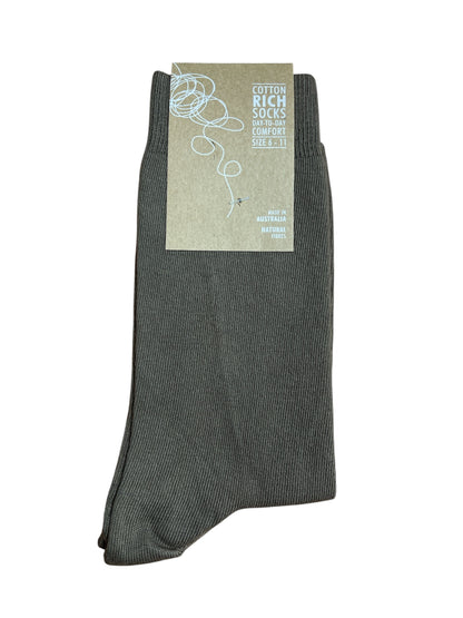 Brown sock with a label on a white background
