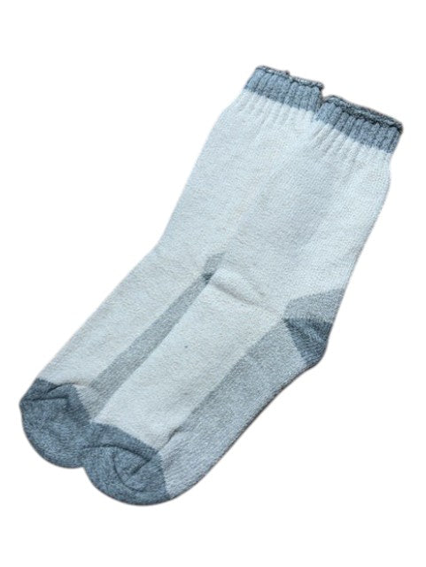 Light blue sock with dark blue trim on a white background