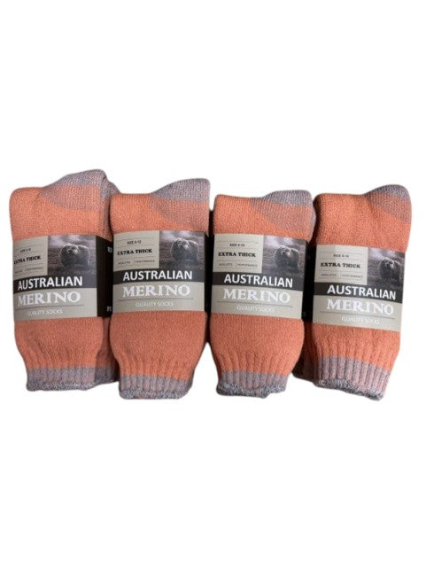 Four pairs of orange socks with labels on a white background