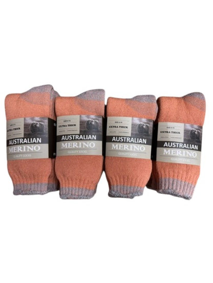 Four pairs of orange socks with labels on a white background