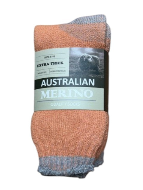 Pair of orange and gray socks with a label on a white background