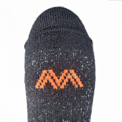 Dark gray sock with orange zigzag pattern on a white background