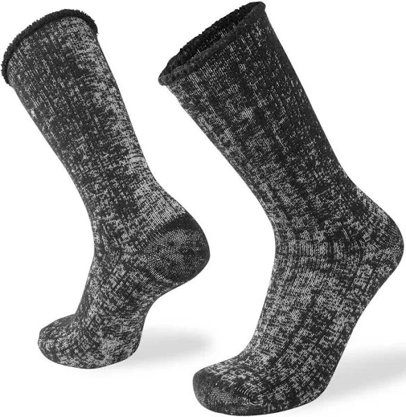 A pair of calf-length merino fleece socks with a textured pattern, featuring a relaxed top and anatomical toe box.