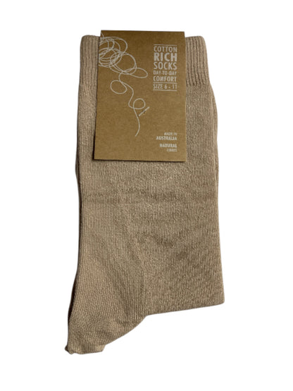 Carnatio sock with a cardboard label on a white background